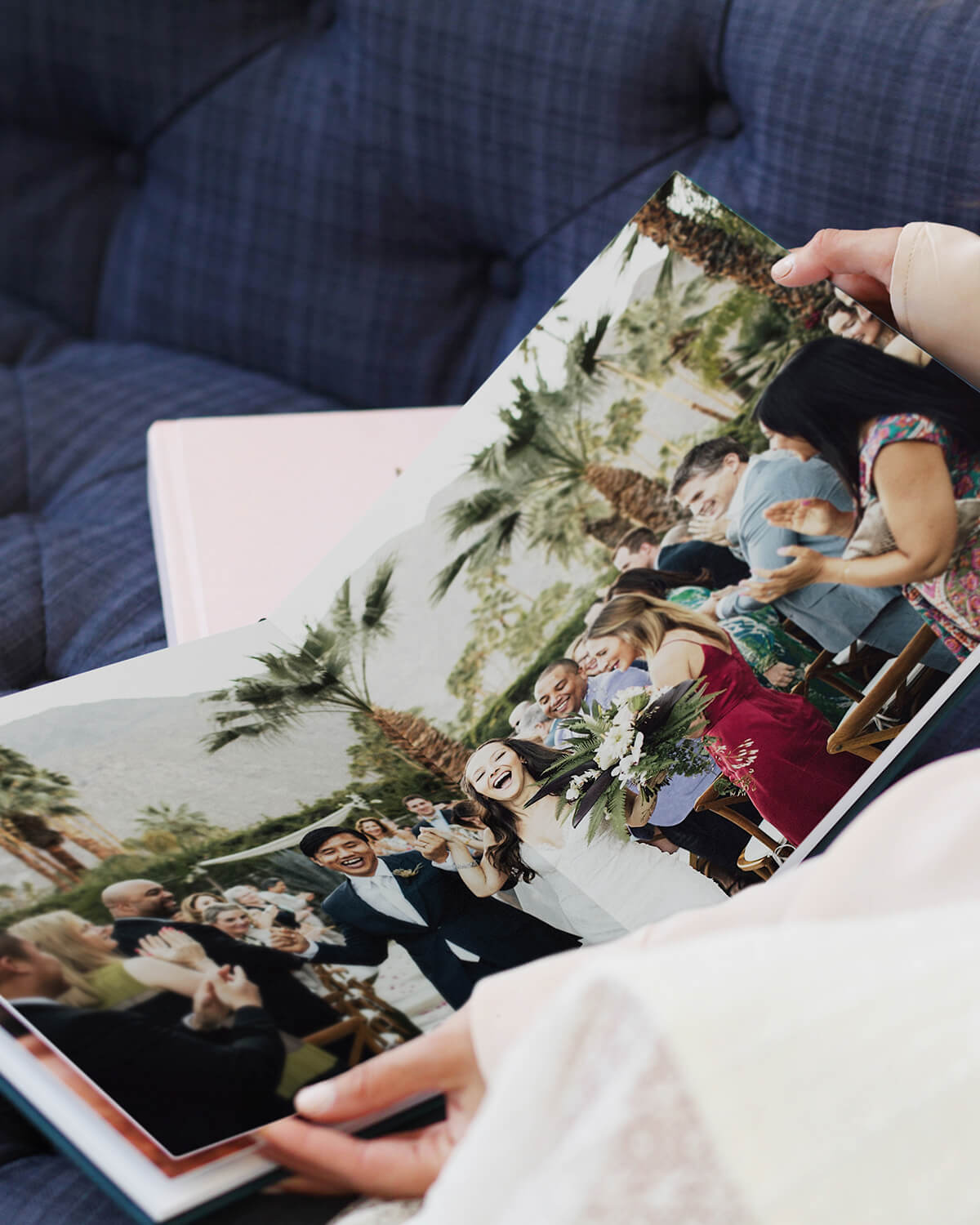 layflat photo album opened to two-page wedding photo spread