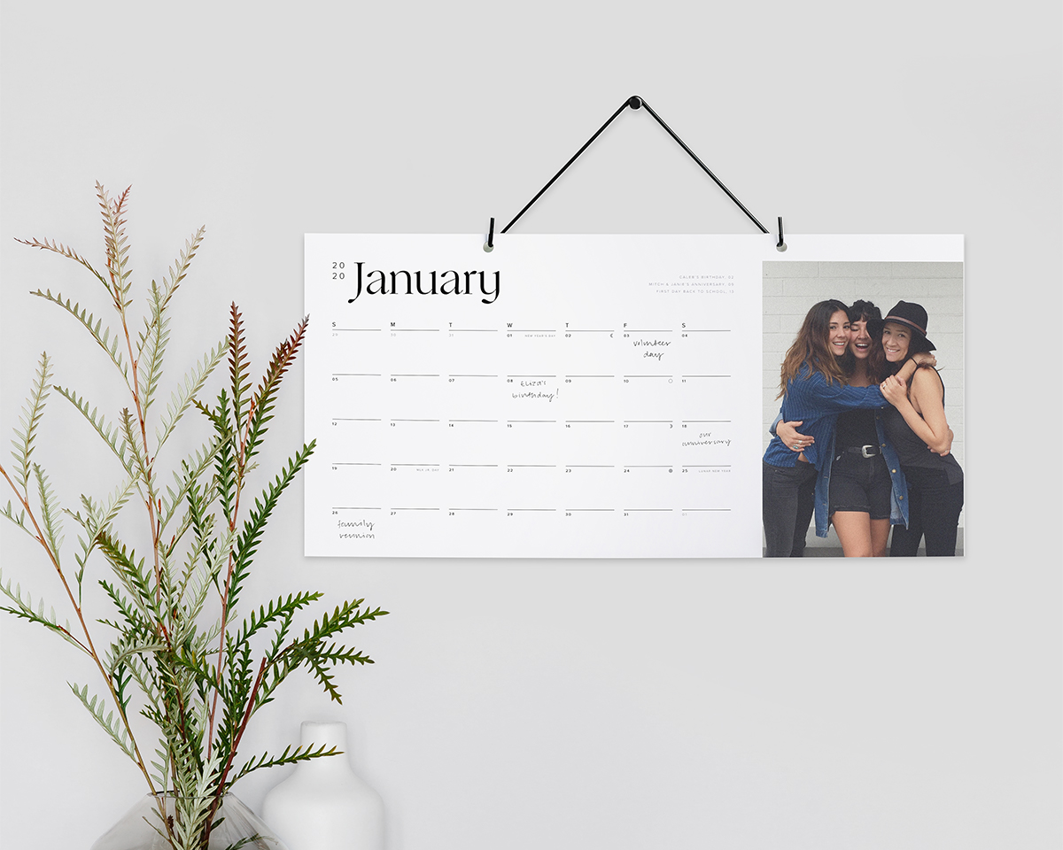 Artifact Uprising Modern Wall Calendar on month of January featuring photo of three friends