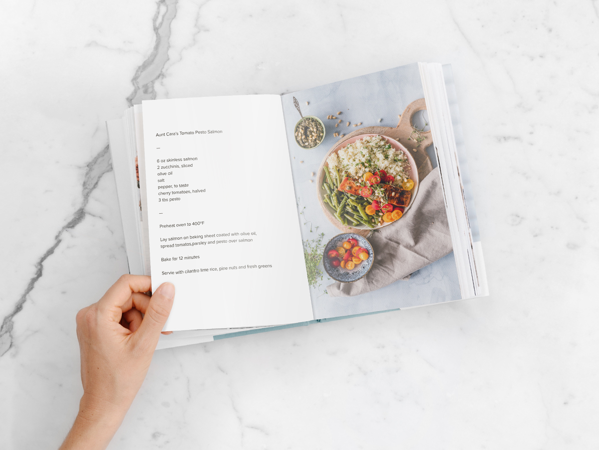 Cookbook opened to family recipe on left side and photo of meal on right