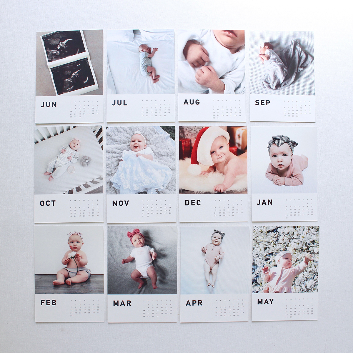 all 12 months of a baby photo calendar laid out next to one another