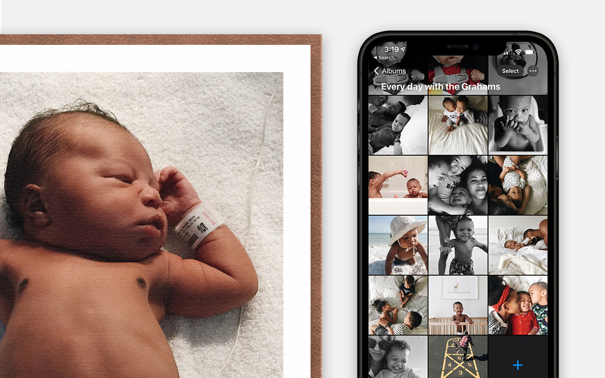 Photo album on iPhone next to framed photo of newborn