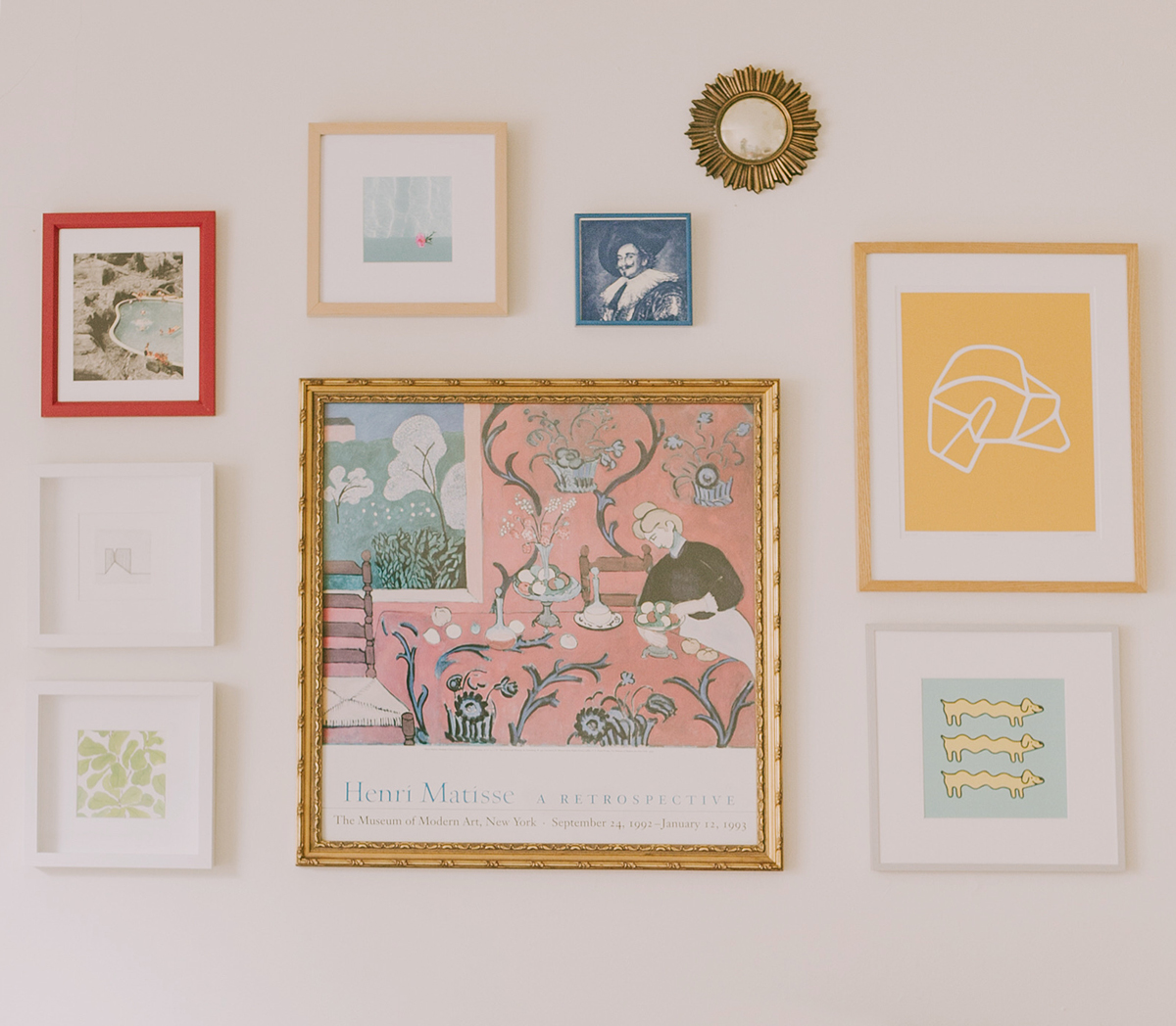Gallery wall with framed art and photos
